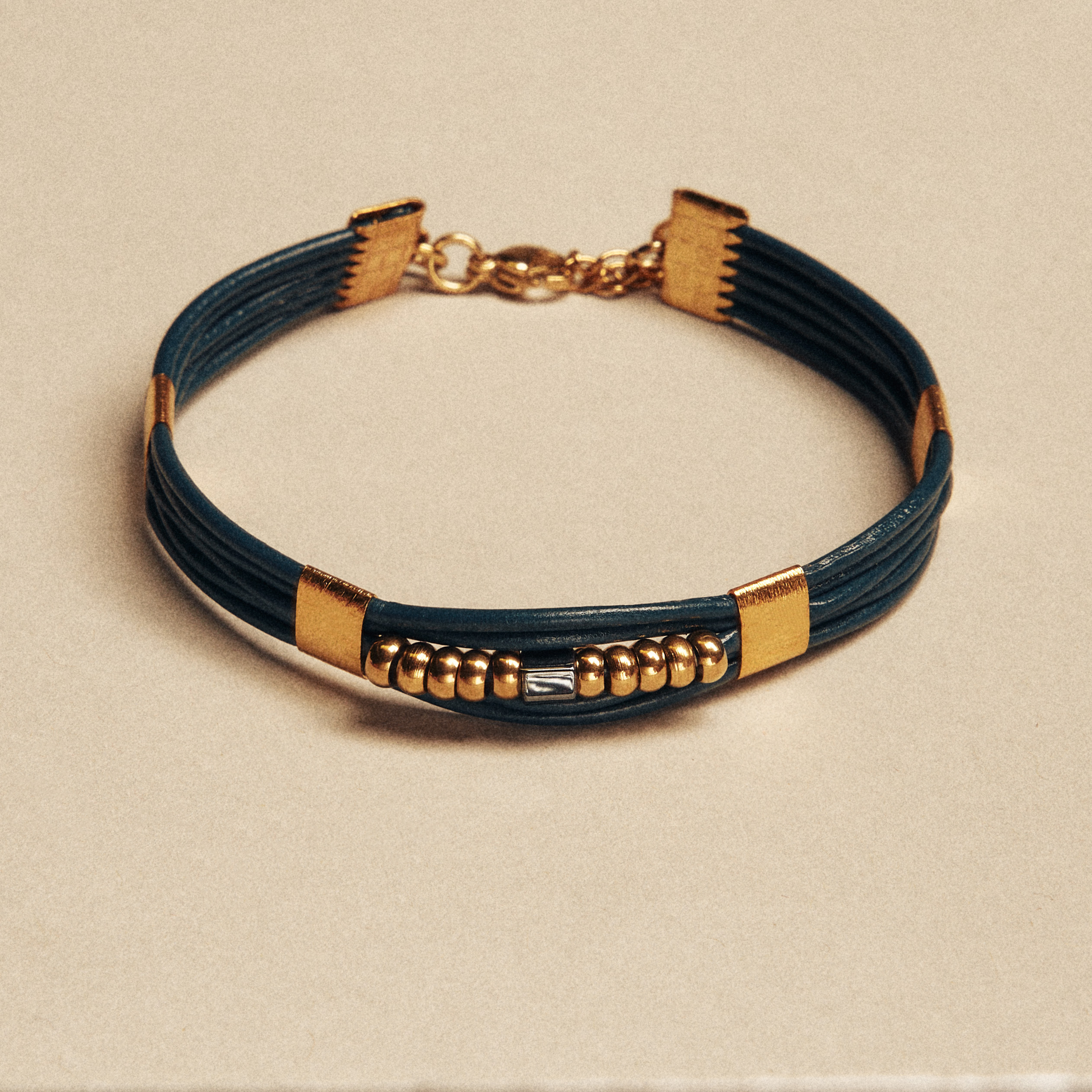 Blue Leather Bracelet with Gold & Black Elements
