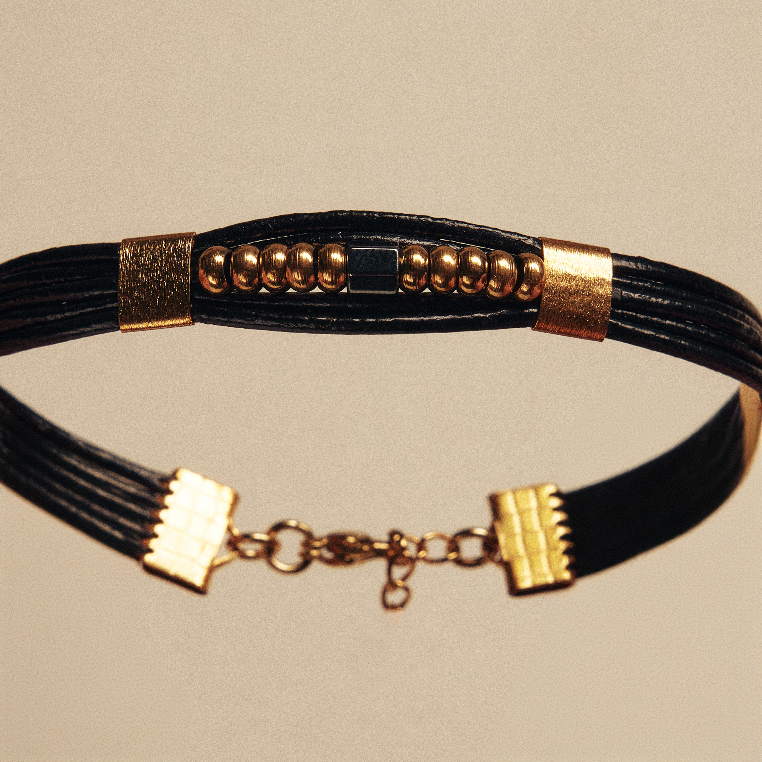 Black Leather Bracelet with Gold & Black Elements - Image 2