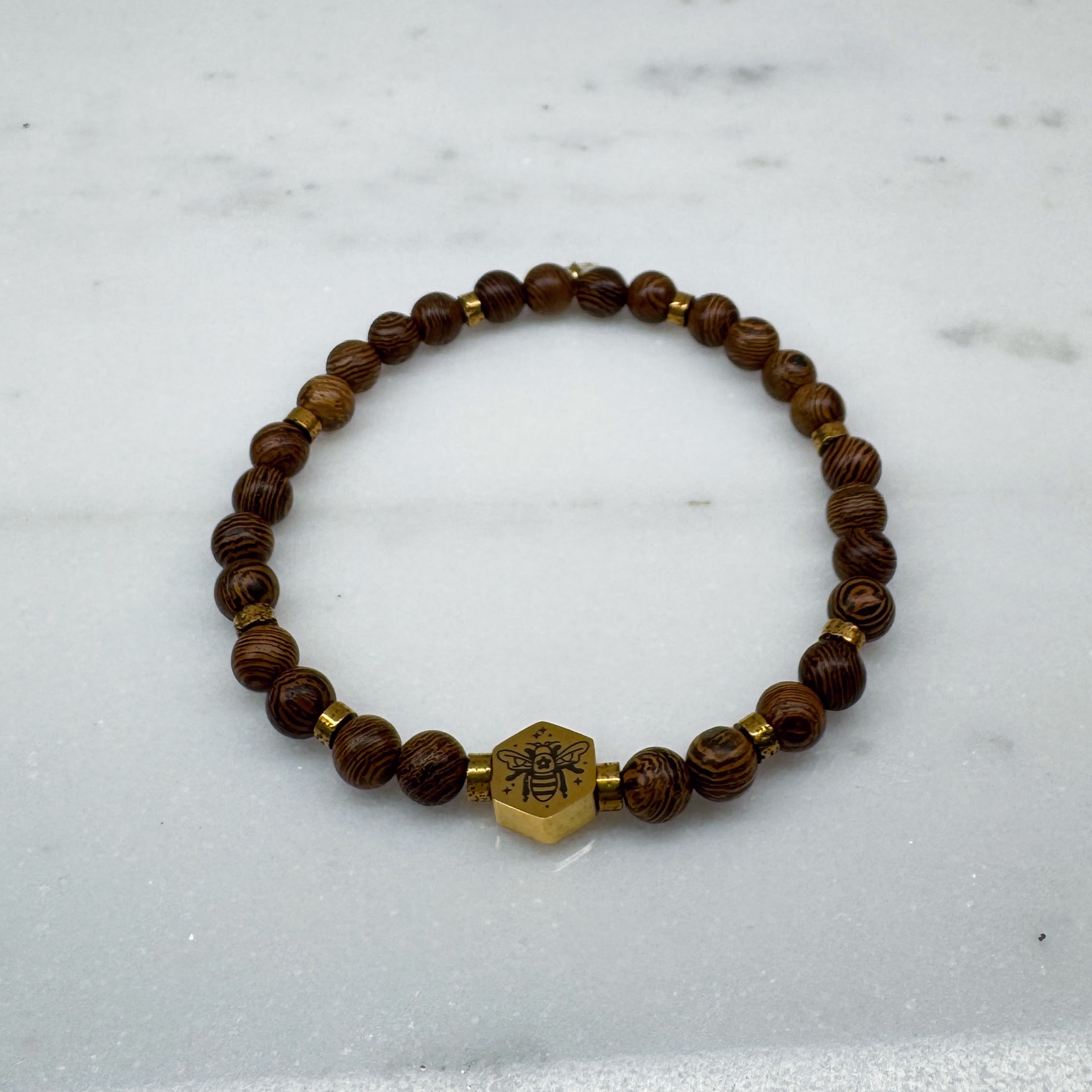 Bracelet of Wooden Beads and a Golden Bee